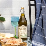 Bottle On A Table With Towel and Food