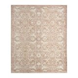 Pink and beige patterned rug with vintage-style floral and geometric motifs Pink and beige patterned rug with vintage-style floral and geometric motifs