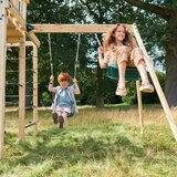 Lifestyle image of two children using the swings Lifestyle image of two children using the swings