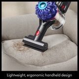 Lifestyle image showing stick vacuum used as handheld vacuum Lifestyle image showing stick vacuum used as handheld vacuum
