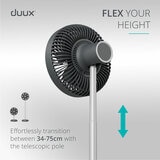 Lifestyle image of Duux Rize Fan transiting between 34 to 75 cm with telescopic pole