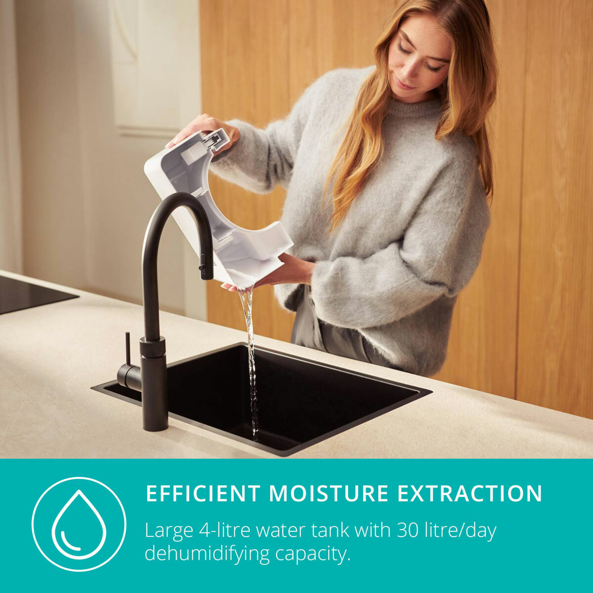 Lifestyle image of Bora Smart Dehumidifier 30L 's water tank being emptied