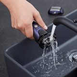lifestyle image of shaver being rinsed