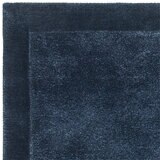 Asiatic rise border rug in navy