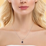 Oval Cut Ruby & 0.16ctw Diamond Halo Pendant, 14ct White Gold