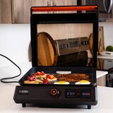 Lifestyle image of Griddle open on a kitchen counter with food Lifestyle image of Griddle open on a kitchen counter with food
