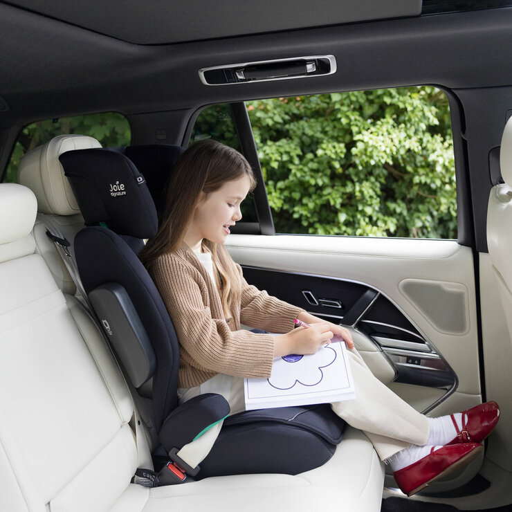 Lifestyle image of a child buckled into the car seat