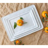 Stacked serving platters with orange