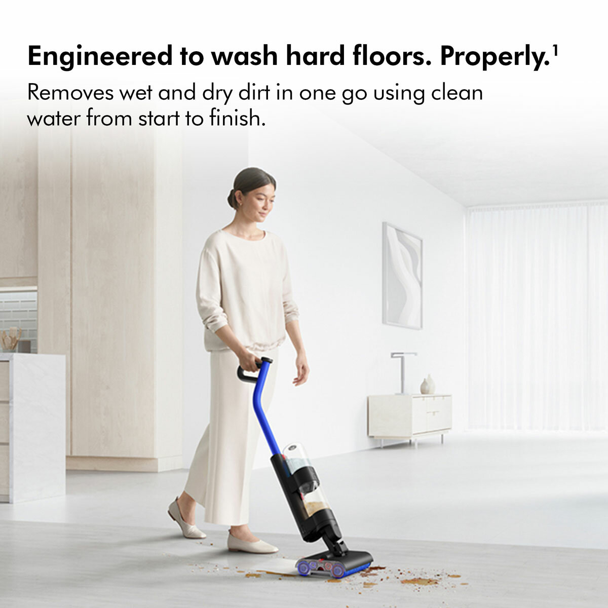 Lifestyle images of Dyson WashG1 wet floor cleaner being used on hard floor