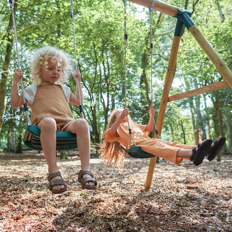Lifestyle image of children playing on the swings