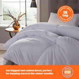 Lifetsyle imagery of thick 18 tog Duvet, styled on bed. 'ideal for winter' badge on image
