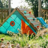 Lifestyle image of the playcentre in a garden Lifestyle image of the playcentre in a garden