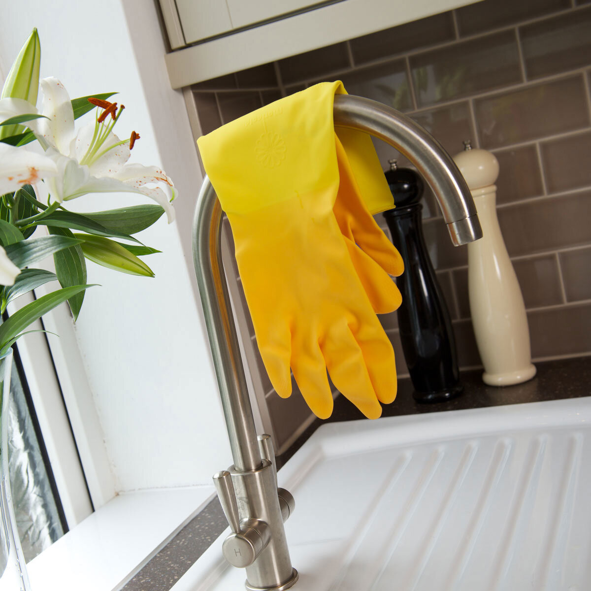 Marigold Gloves Hanging Over a Sink