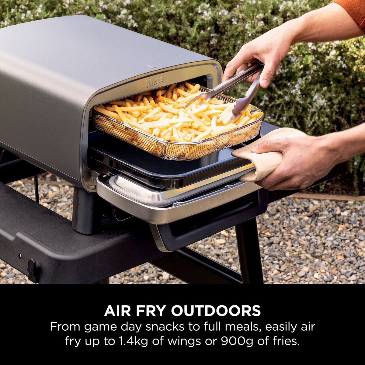 Lifestyle image showing air frying outdoors Lifestyle image showing air frying outdoors