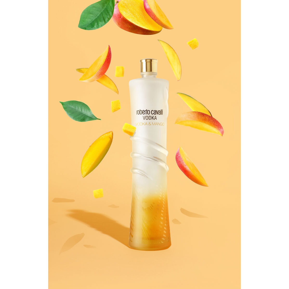 Roberto Cavalli Vodka Mango, with mangos around it