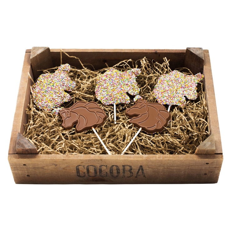 Choc Lollipops in wooden crate with tissue paper Choc Lollipops in wooden crate with tissue paper