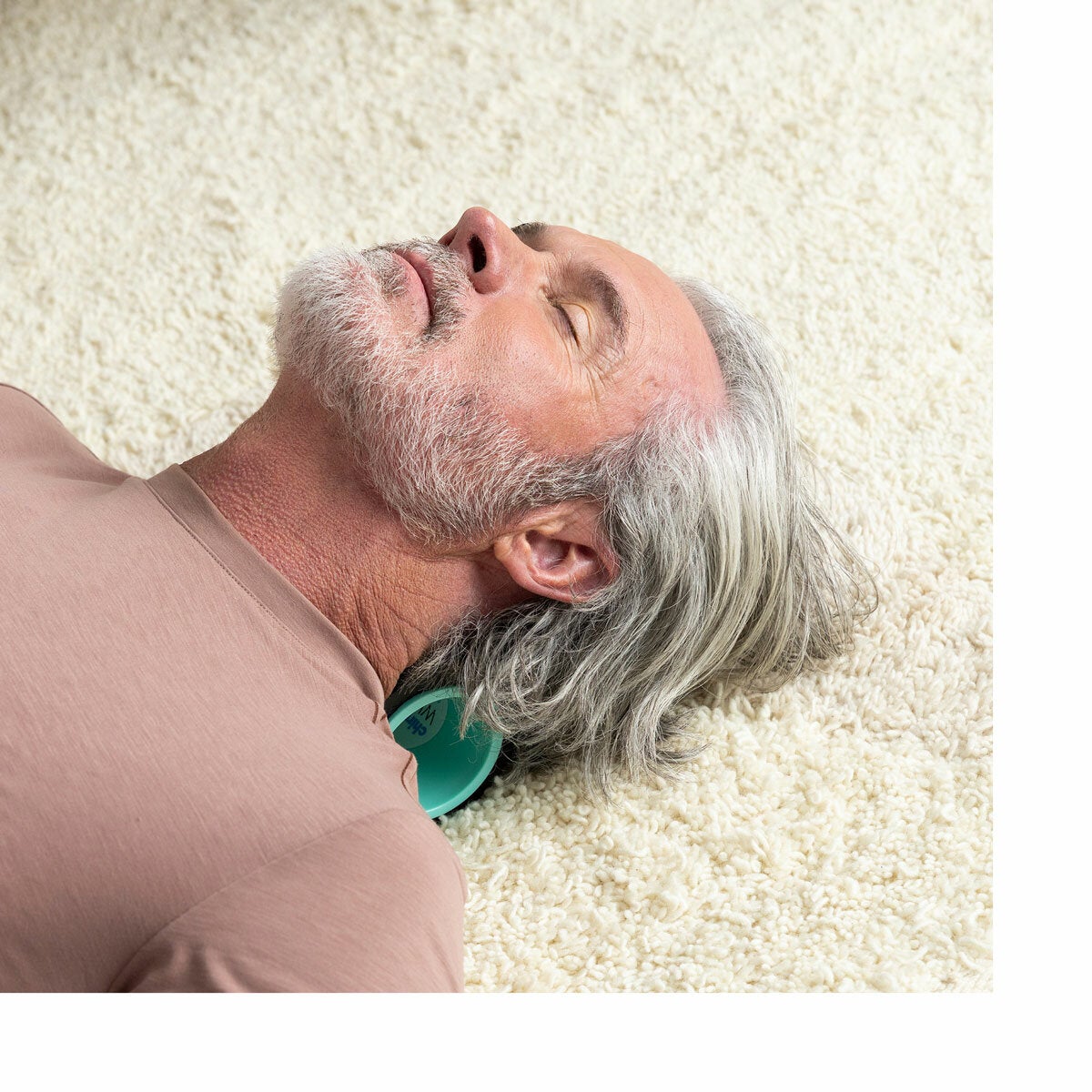 Lifestyle image of a man using a wheel on his neck