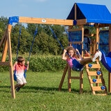 Lifestyle image of two children playing on the swings
