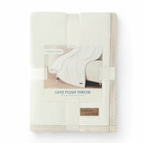 Folded Ivory throw in packaging