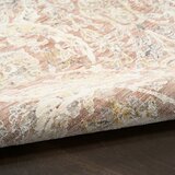 Pink and beige patterned rug with vintage-style floral and geometric motifs Pink and beige patterned rug with vintage-style floral and geometric motifs