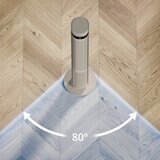 Lifestyle image of Duux Elevate Tower Fan oscillating up to 80 degrees