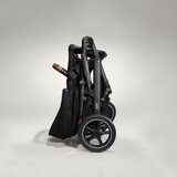 Studio image of the stroller, folded