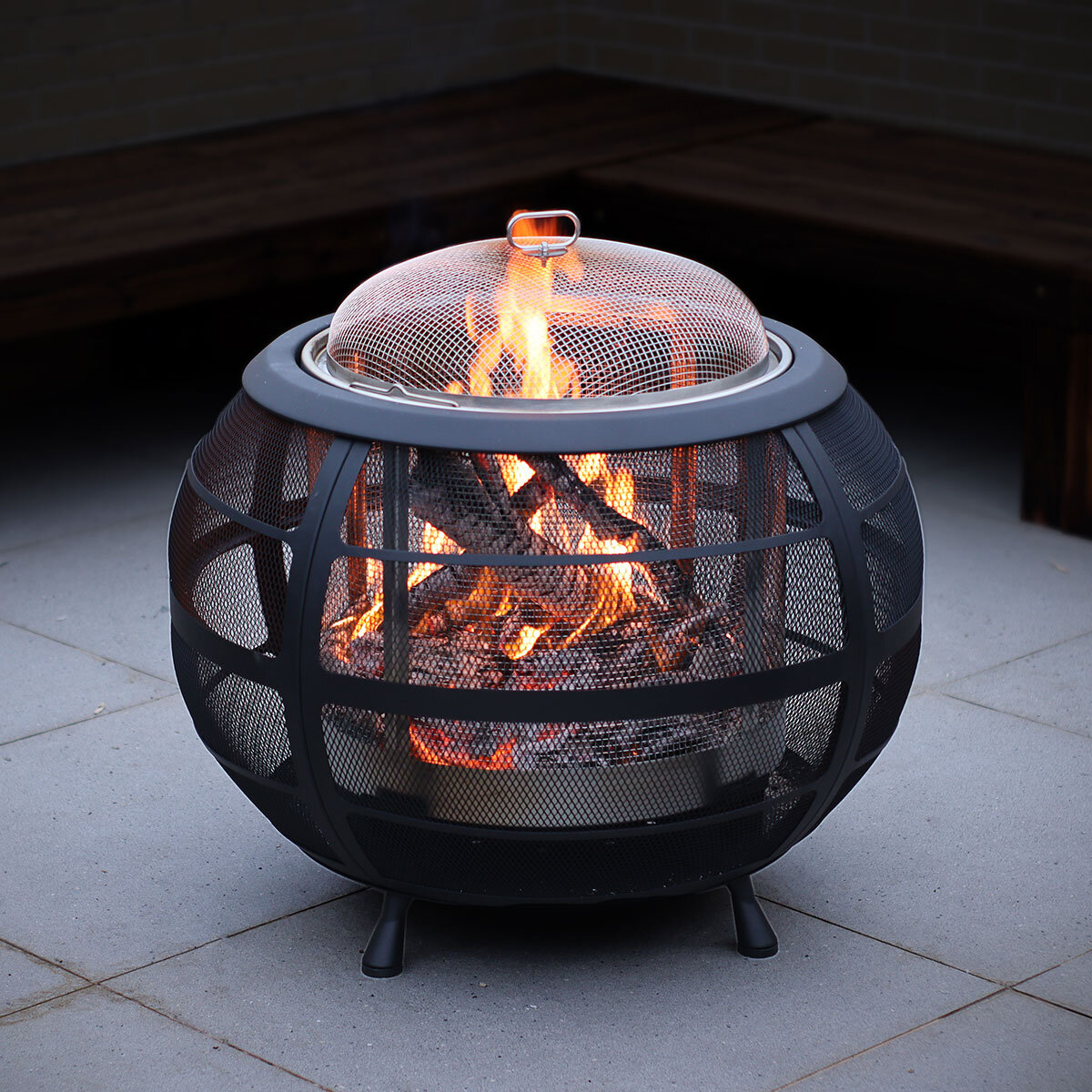 Modern sphere design creates a beautiful fire feature with the warmth, smells and sound that only a real wood fire can provide