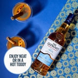 Lifestyle image of bottle on colourful background with cocktail