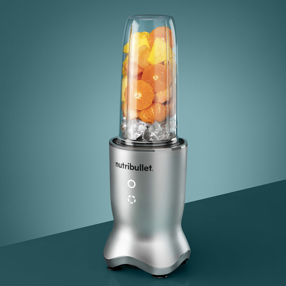 Lifestyle Image of Nutribullet Ultra Deluxe Blender with fruits inside and ice