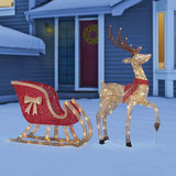 Side view of Deer with sleigh on a seasonal background