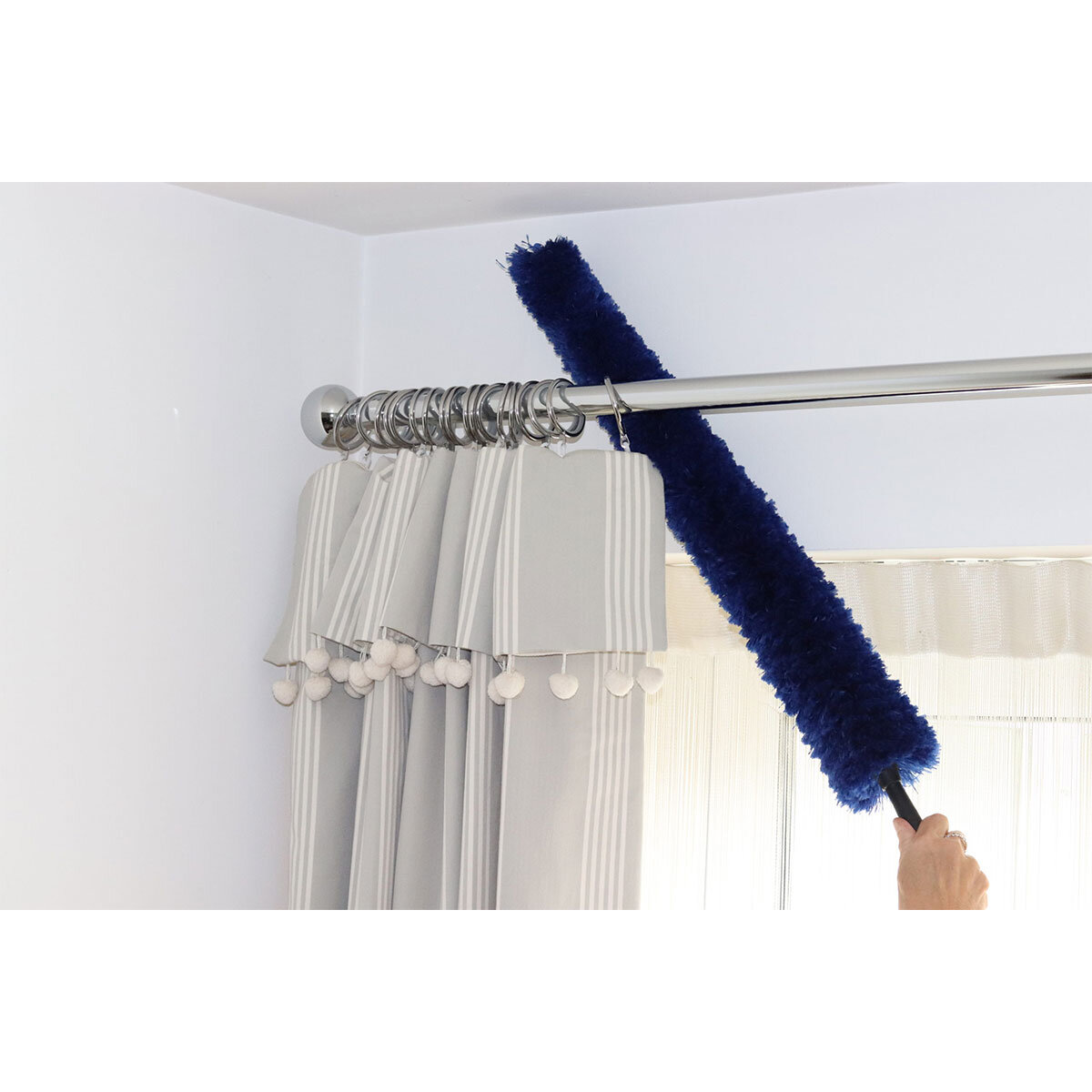 Lifestyle image of duster being used to clean