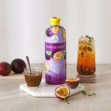 Bottle on Table with Full Glass