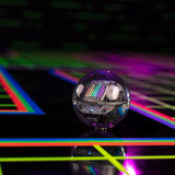 Front image of the sphero BOLT electronic interactive toy robot on a black background with neon lights