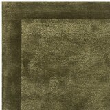 Asiatic Rise border rug in olive green