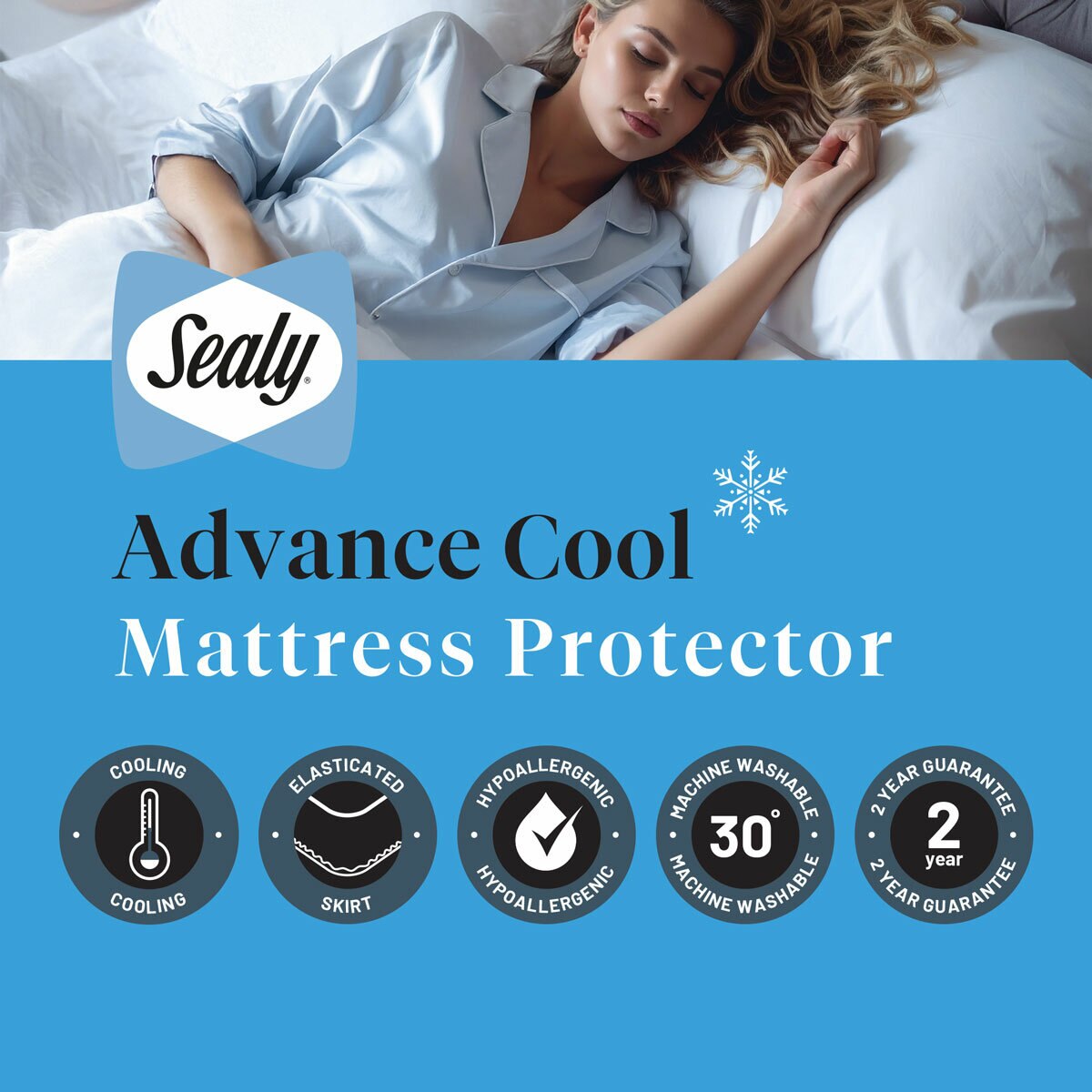 A fitted white mattress protector with a hexagonal quilted pattern on a neatly made bed in a modern bedroom