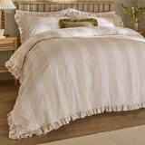 Beige and white striped duvet set with ruffled edges and matching pillow shams.