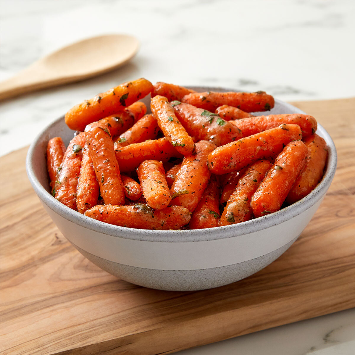 Carrots covered in herbs in a Bowl