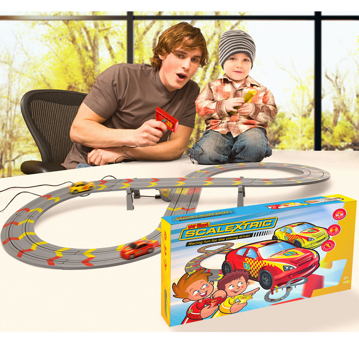 2 boys playing My First Scalextric Set