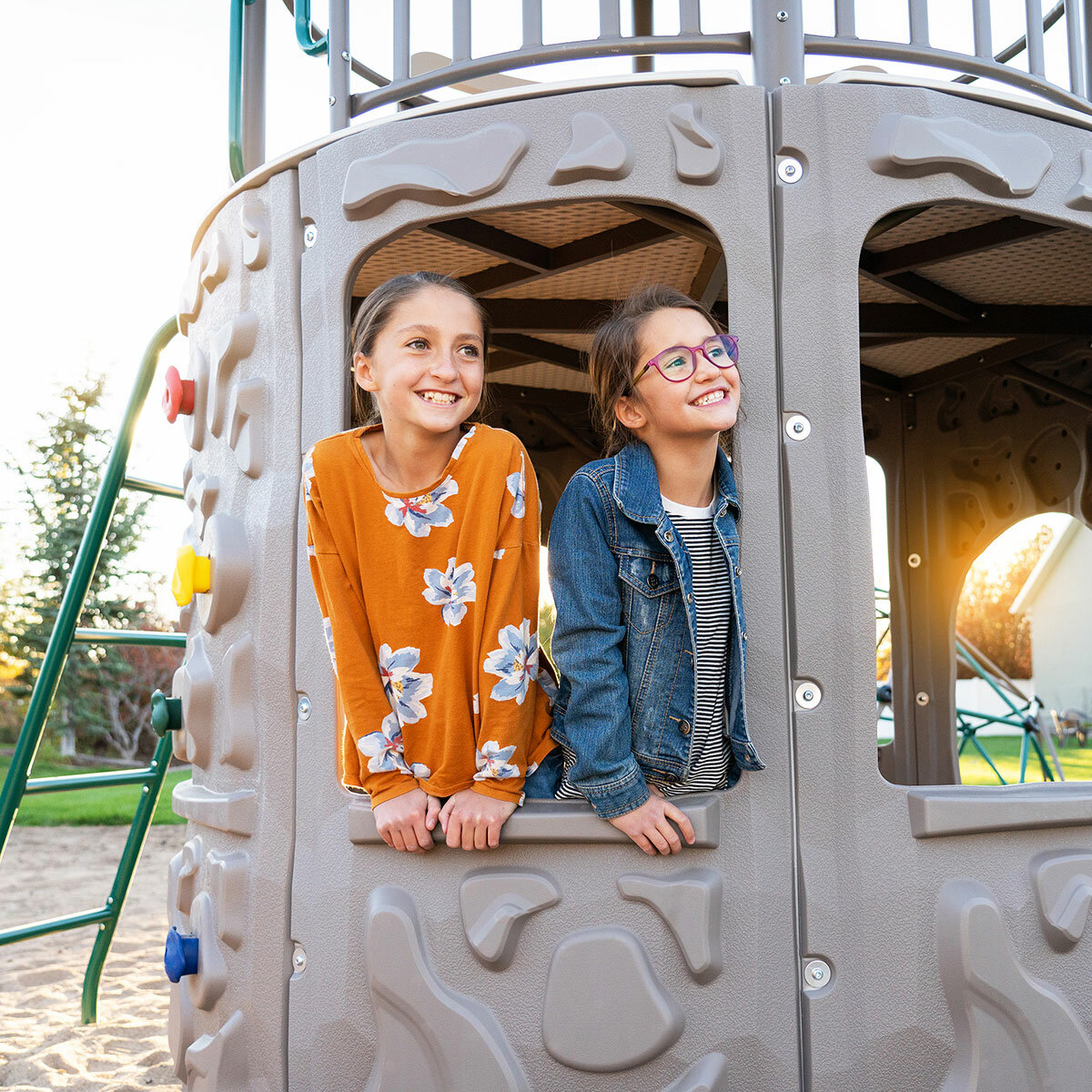 Lifestyle image of two children looking out from the Lifetime Adventure Tower Playset