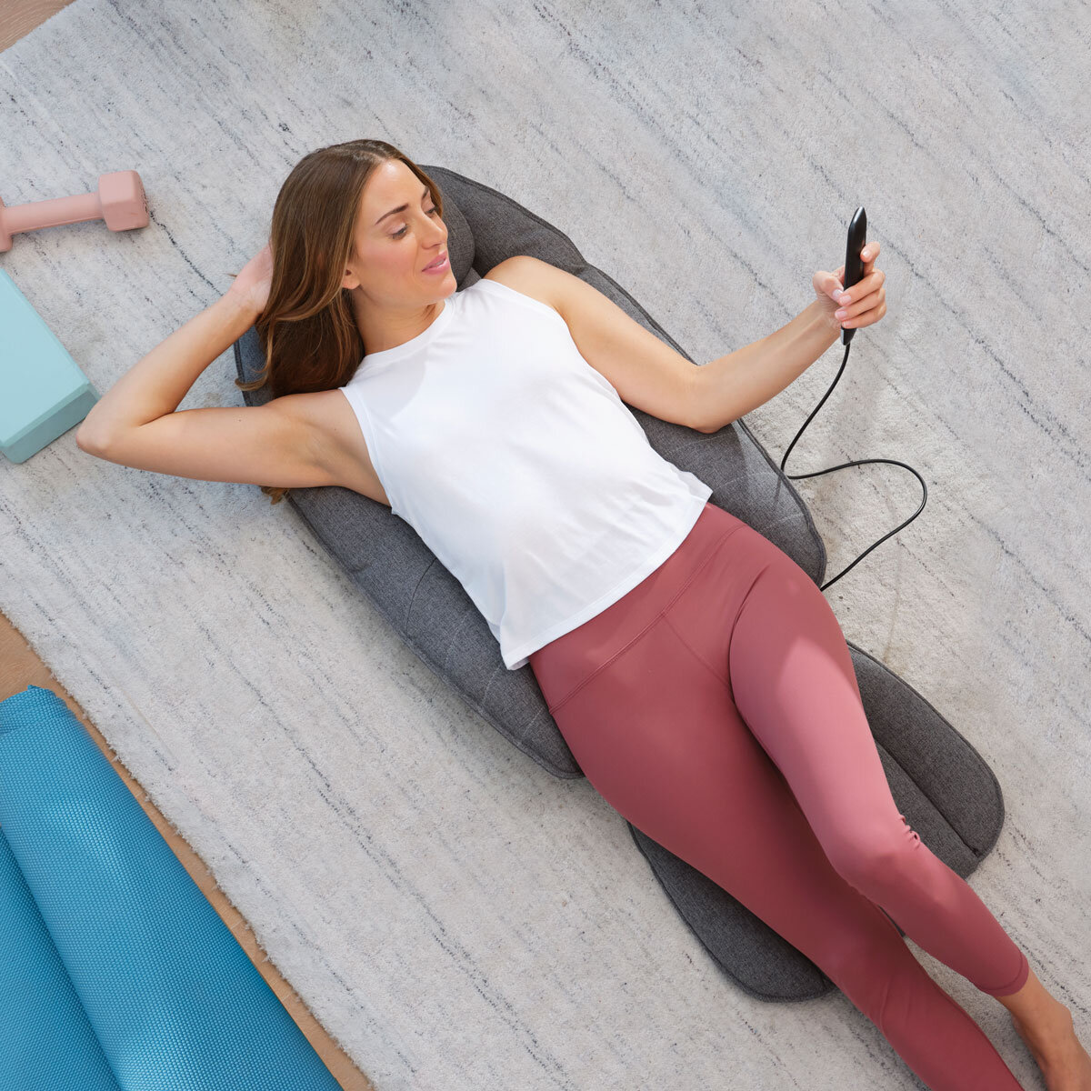 Lifestyle Image of Homedics Recline Shiatsu Massage Cushion of woman lying on ground