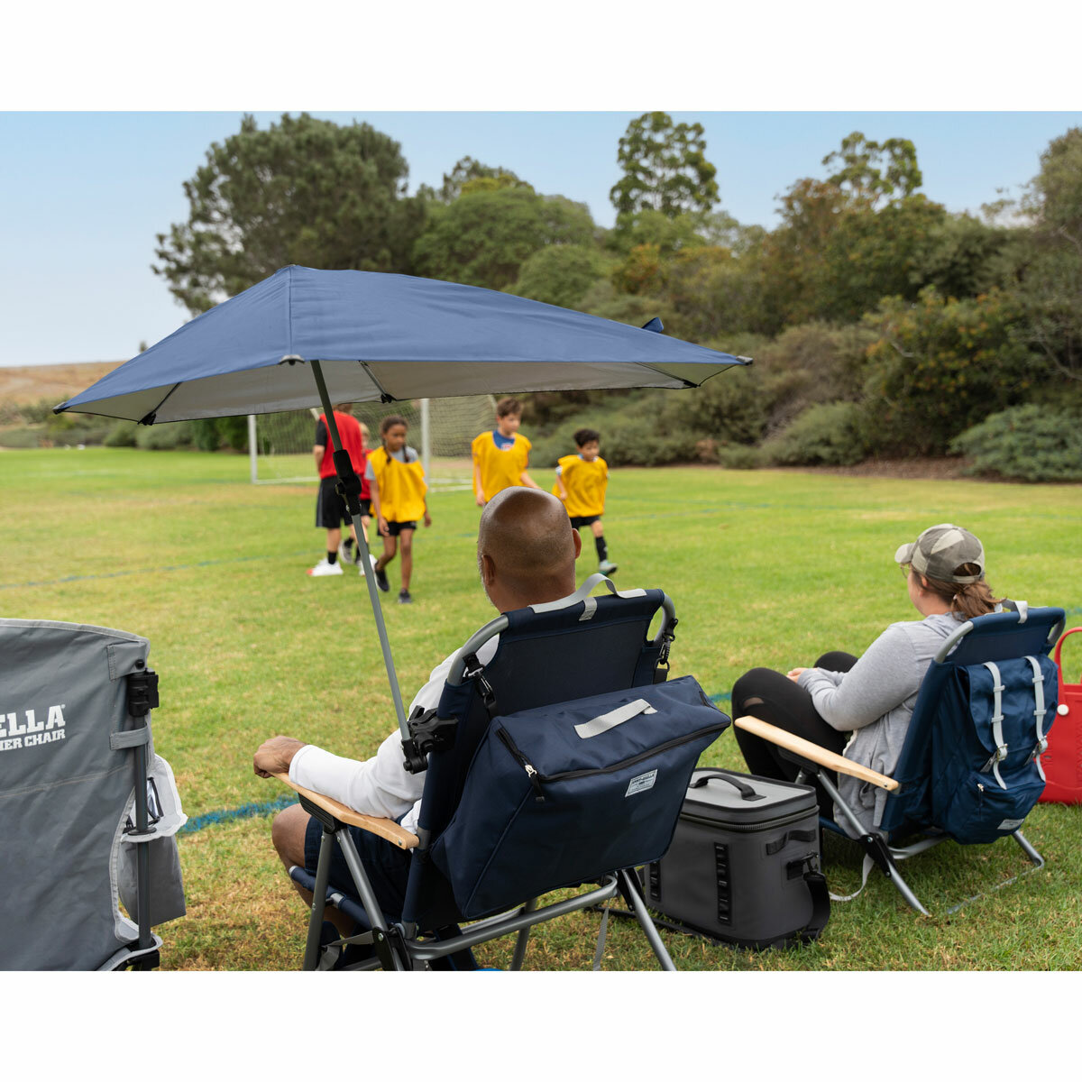 ifestyle image of someone sat in a chair with the Versa-Brella attached