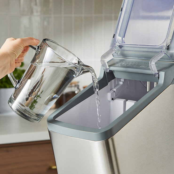 Lifestyle image of water being poured into ice maker