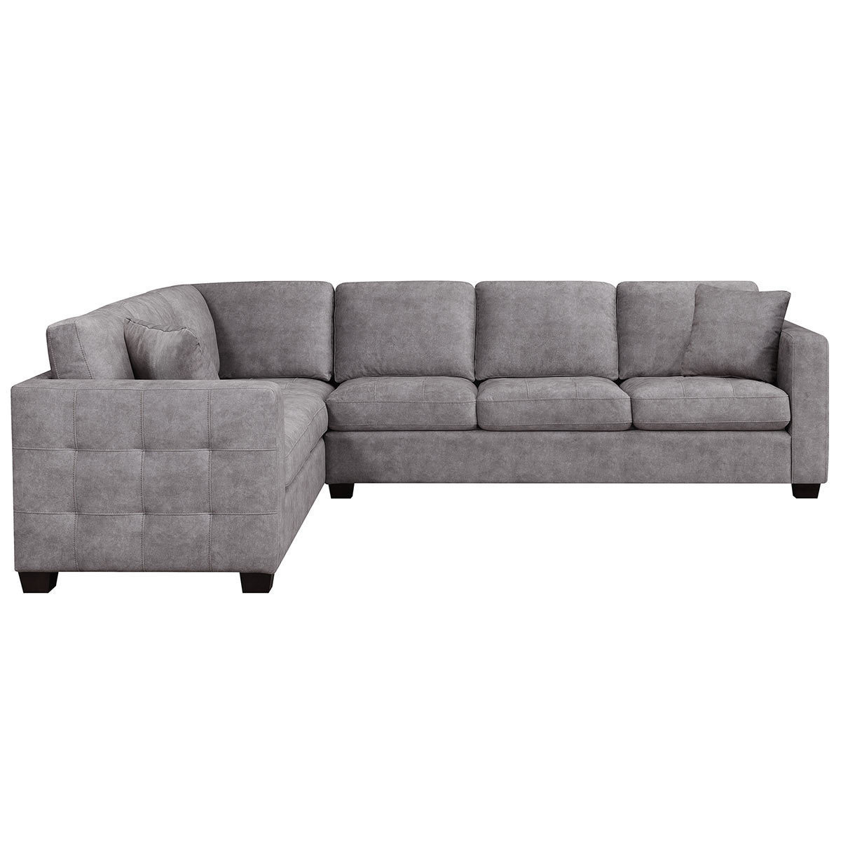 Cut out image of corner sofa side view on white background showcasing buttoned side