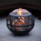 Modern sphere design creates a beautiful fire feature with the warmth, smells and sound that only a real wood fire can provide