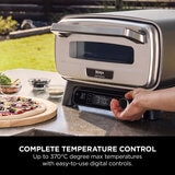 Lifestyle image of pizza oven being used outdoors reaching up to 370 degrees Lifestyle image of pizza oven being used outdoors reaching up to 370 degrees