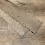 Close up image of flooring with two loose planks