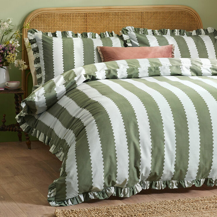 Green and white striped duvet set with scalloped detailing and matching pillow shams. Green and white striped duvet set with scalloped detailing and matching pillow shams.