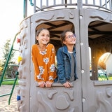 Lifestyle image of two children looking out from the Lifetime Adventure Tower Playset