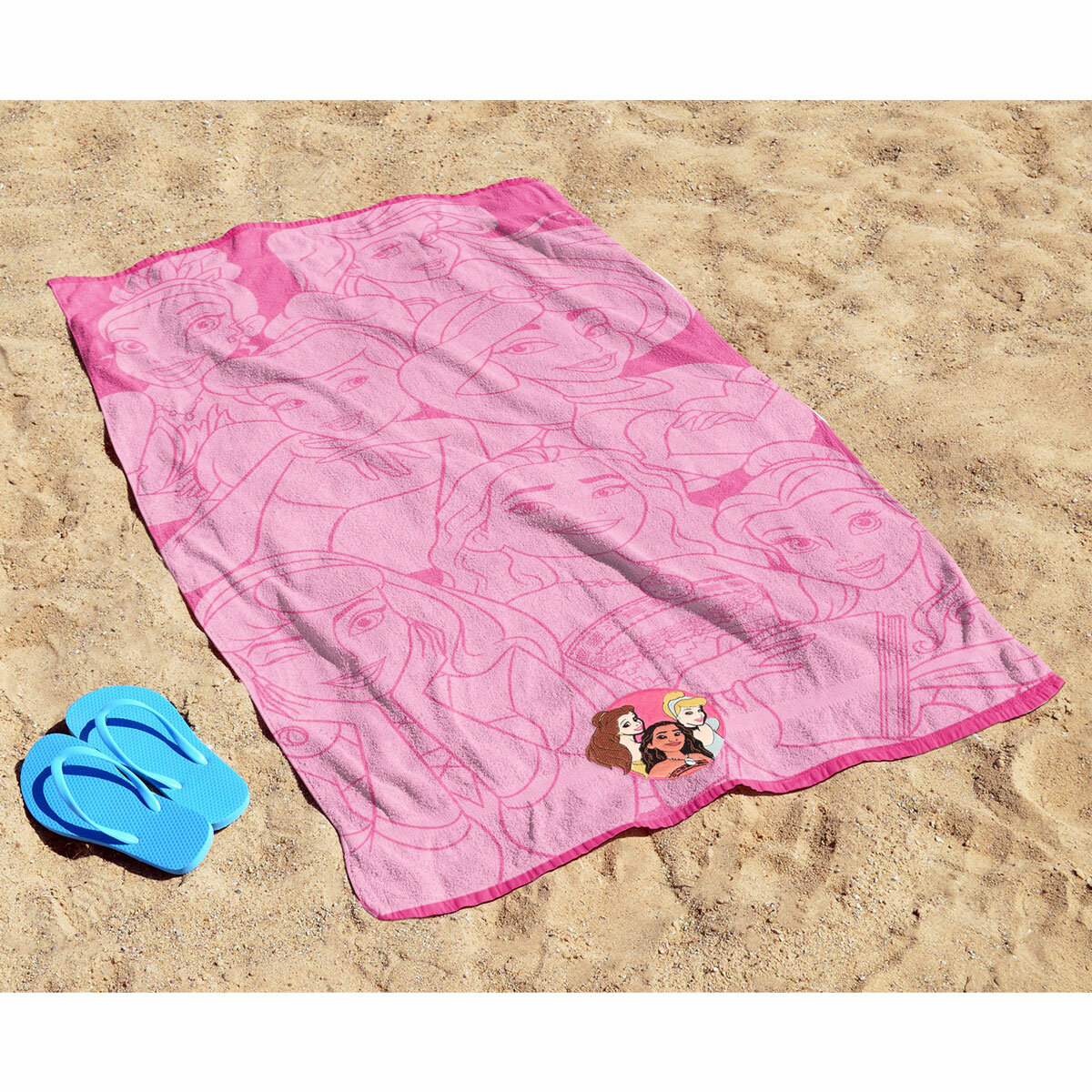 Pink Princess character beach towel laid out on sand