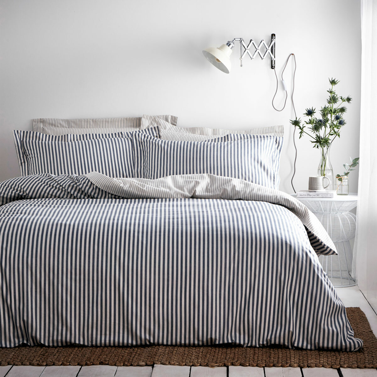Blue and white vertically striped duvet set with matching